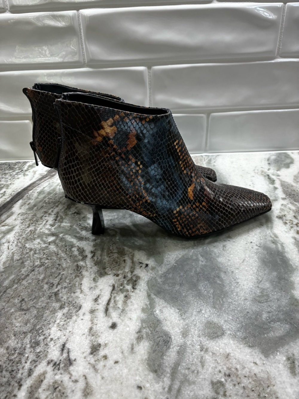 Women’s Brown Snake-Print Pointed Toe Ankle Boots by
Donald Pliner.
